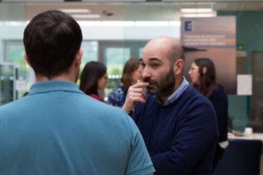 Researcher Dr Jose De Vega chatting to another colleague during a recent meeting
