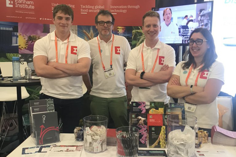 Ben, alongside EI staff members at PAG Conference Ben, alongside EI staff members at PAG Conference