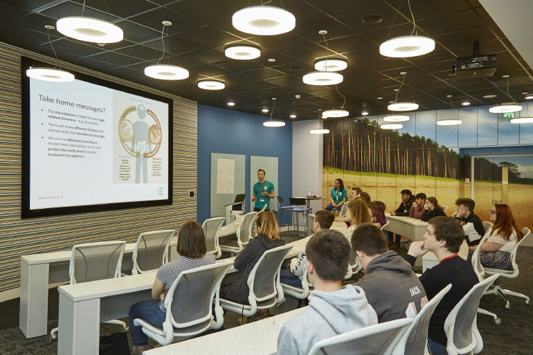 PhD student Matthew Madgwick delivering a presentation on the microbiome PhD student Matthew Madgwick delivering a presentation on the microbiome