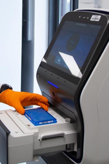 EI researcher handling samples in the lab 