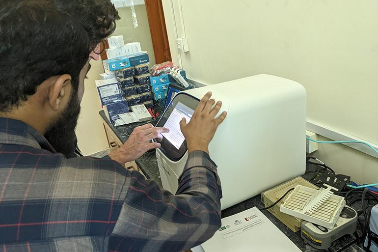 Gastropak Scientists with sequencing technology in a lab in Pakistan