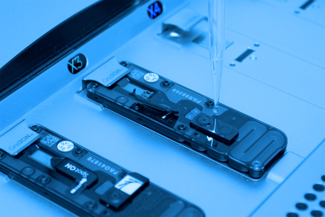 Close up of nanopore sequencing technology with a blue colour filter over