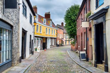 Cobbled streets lined with shops and houses at Elm Hill in Norwich, Norfolk