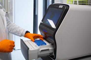 EI researcher handling samples in the lab 