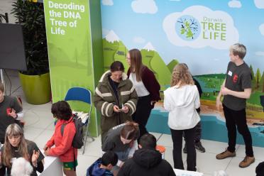 Visitors at the Darwin Tree of Life stand in the Forum, Norwich