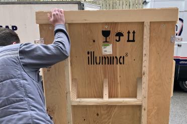 Wooden crate housing the new Illumina NovaSeqX arrives on site at the Earlham Institute