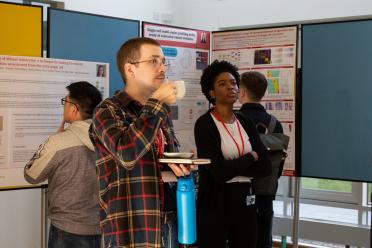 Delegates at the single-cell symposium browsing the research posters on display