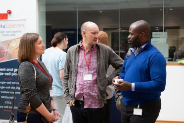 Delegates at the single-cell symposium networking during the coffee break