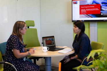 Year in Industry student Angel Chandwani talking to Head of Advanced Training, Emily Angiolini