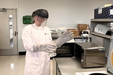 Year in Industry student Santa Walker with lab safety equipment on in the lab