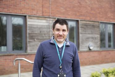 Jim Lipscombe standing outside the Earlham Institute building