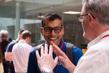 Delegates networking during the symposium