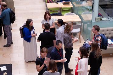 Delegates networking during a coffee break, including Keynote speakers Prof Muzlifah Haniffa from Wellcome Sanger Instituyte, and Dr Tanya Foley from Institut Pasteur