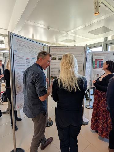 Dr Mark McMullan discusses his pathogen research during the industry poster showcase