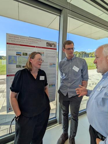 Dr Rachel Rusholme-Pilcher and Charles dickinson present their research during the poster showcase