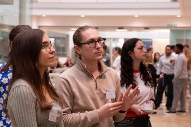 PhD students during a poster session event