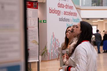 PhD students during a poster session event