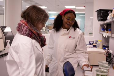 JIF Intern Chinemerem explains her work to ARIA Synethic Plants programme lead Dr Angie Burnett