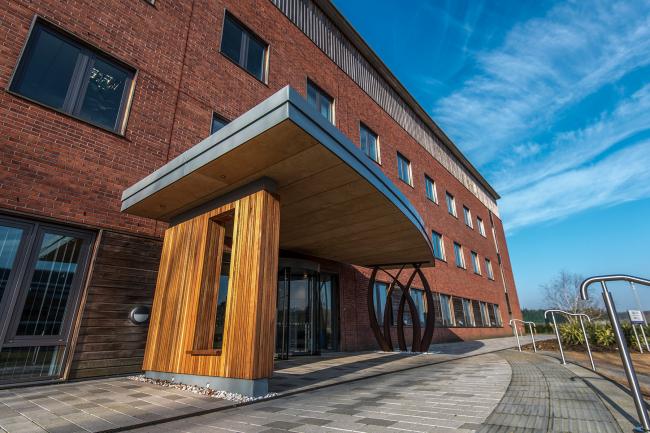 Outside the entrance of the Earlham Institute building on the Norwich Research Park