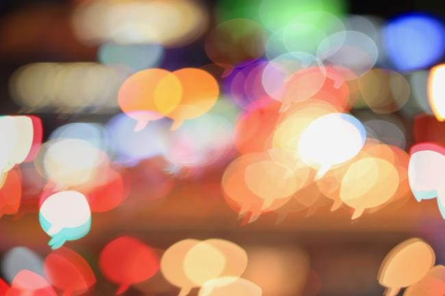 Blurred lights at night in shape of speech bubbles
