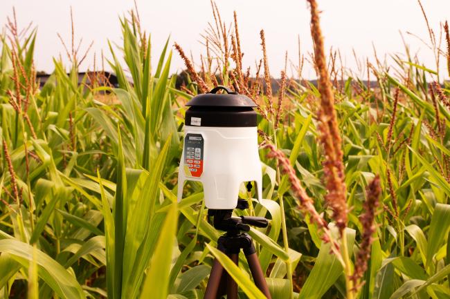 An air sampler standing in a crop field
